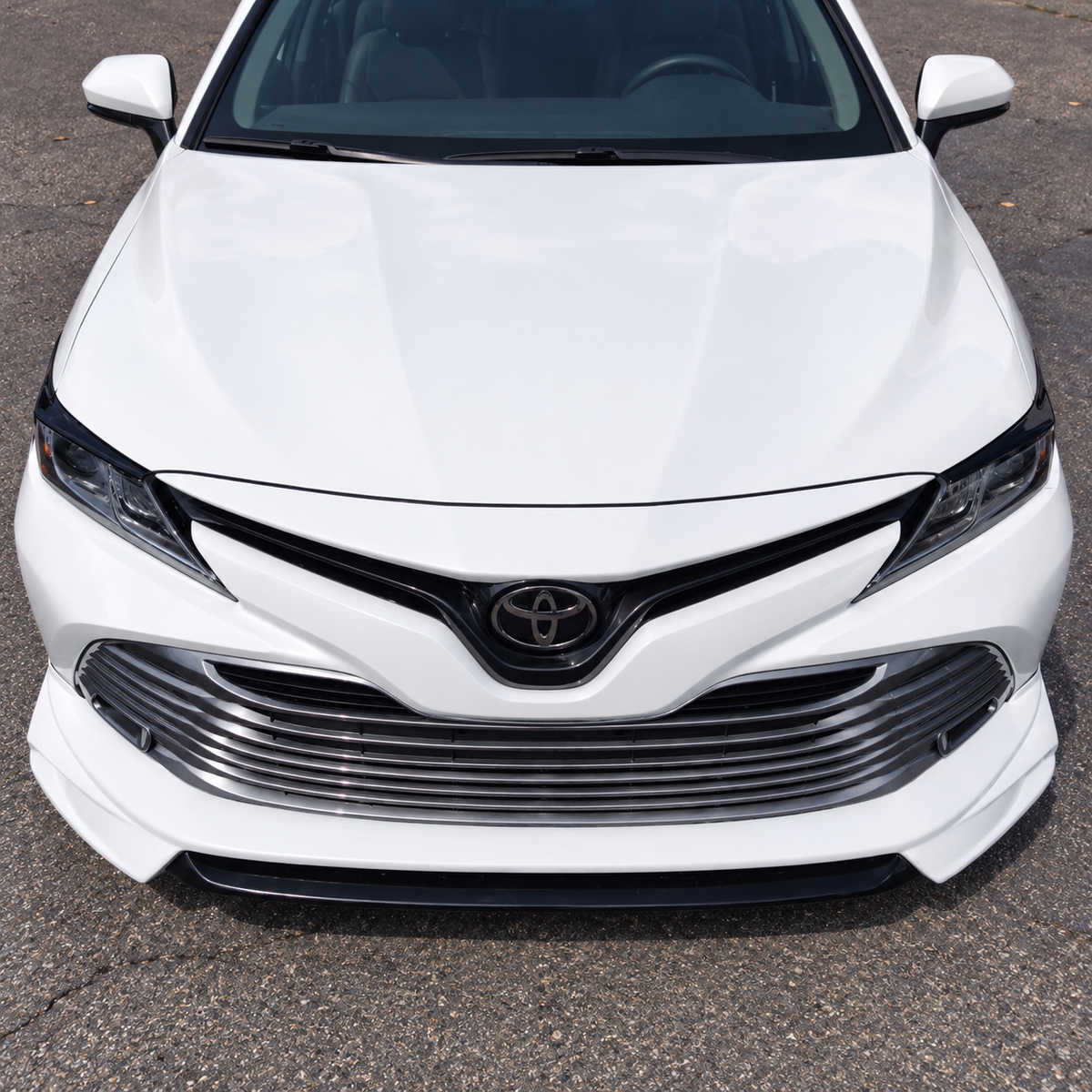 2018-2024 Camry Gloss Black Headlight Eyelid Covers — headlight eyelids on a white Camry, straight front view