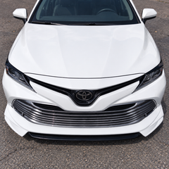 2018-2024 Camry Gloss Black Headlight Eyelid Covers — headlight eyelids on a white Camry, straight front view