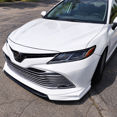 2018-2024 Camry Gloss Black Headlight Eyelid Covers — headlight eyelids installed on a white Camry, front angle