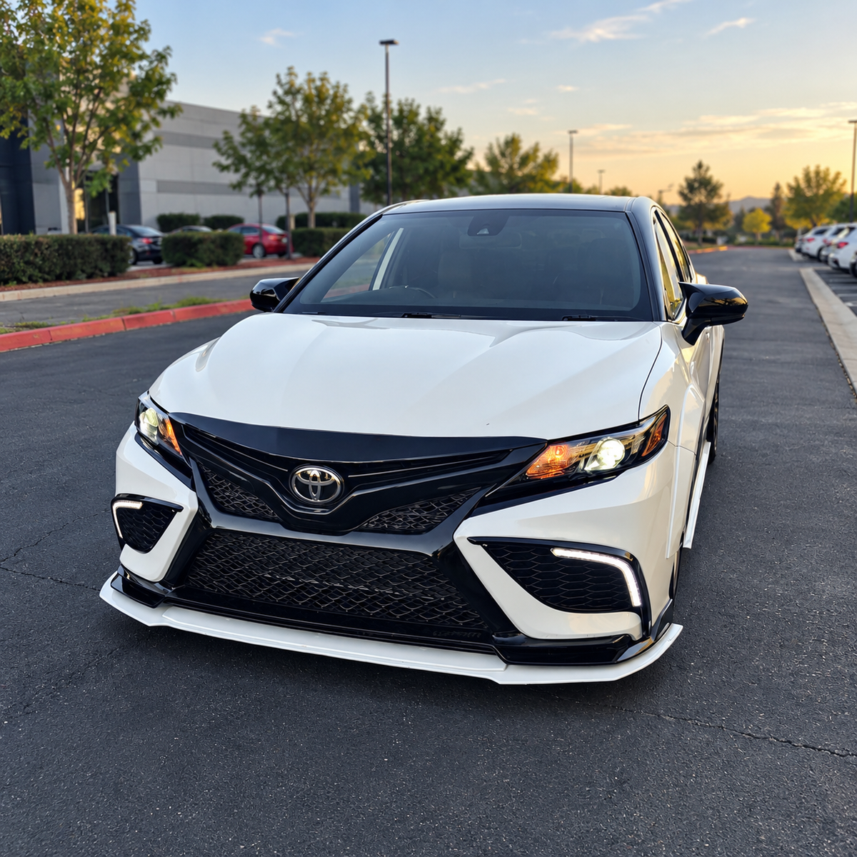 2018-2024 Camry SE/XSE/TRD Upper Front Bumper Garnish — upper bumper garnish on a white Camry, exterior view
