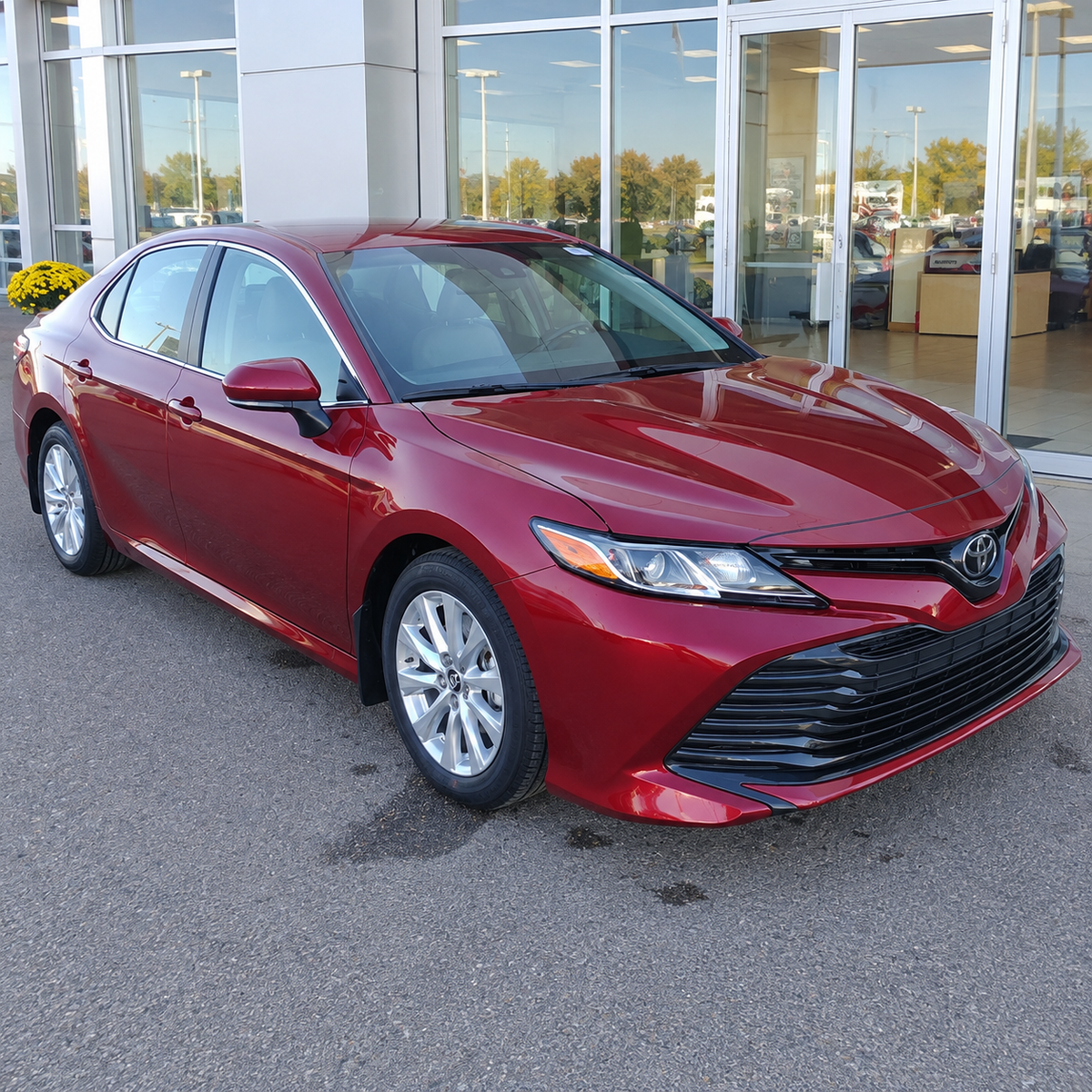 2018-2024 Camry LE/XLE 4-Piece Splash Guards — LE/XLE splash guards on a red Camry, front angle