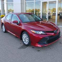 2018-2024 Camry LE/XLE 4-Piece Splash Guards — LE/XLE splash guards on a red Camry, front angle