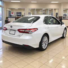 2018-2024 Camry LE/XLE 4-Piece Splash Guards — LE/XLE splash guards on a white Camry, rear angle